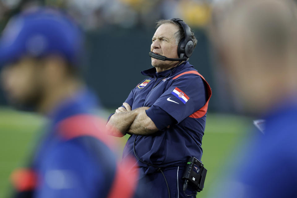 New England Patriots head coach Bill Belichick watches from the sideline during overtime in an NFL football game against the Green Bay Packers, Sunday, Oct. 2, 2022, in Green Bay, Wis. The Packers won 27-24. (AP Photo/Matt Ludtke)