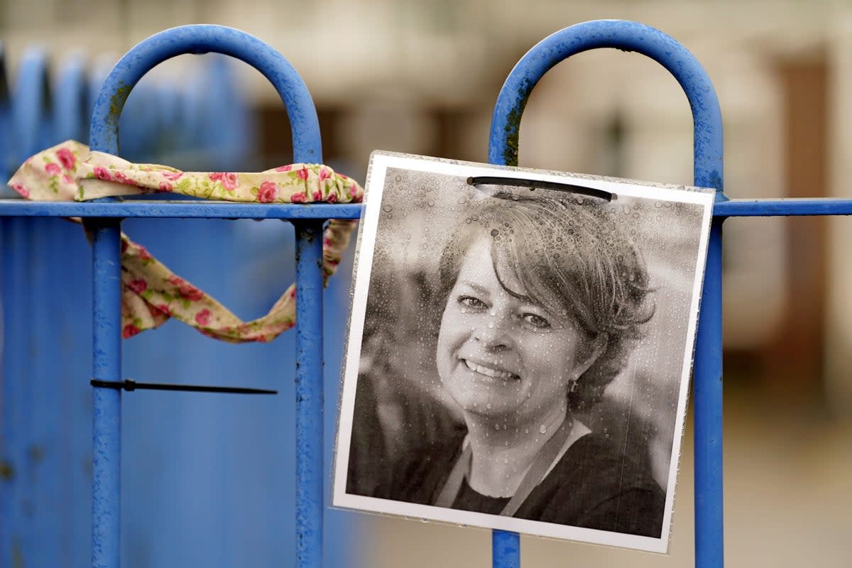 A photograph of Ruth Perry attached to the fence outside John Rankin Schools in Newbury (PA Wire)