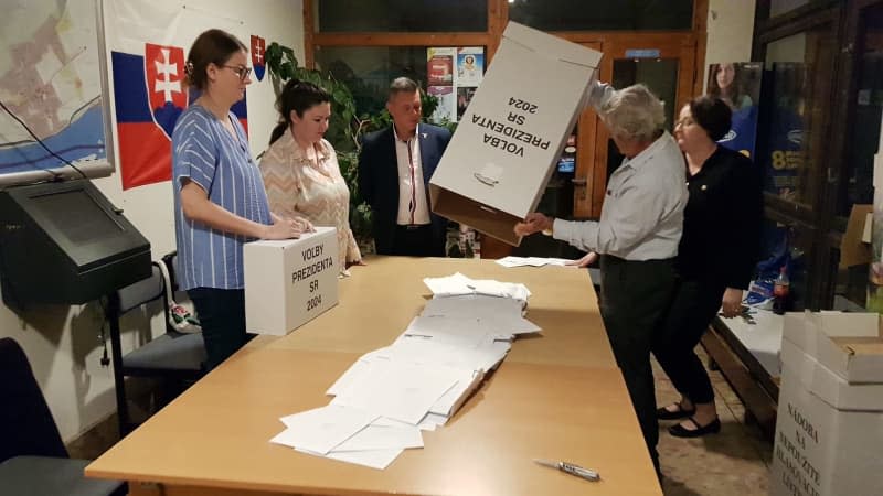 Members of the precinct election commission count the votes after the second round of the 2024 Slovakia presidential election. Milan Drozd/TASR/dpa