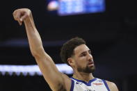 Golden State Warriors guard Klay Thompson reacts after making a three-point basket against the Utah Jazz during the first half of an NBA basketball game in San Francisco, Sunday, April 14, 2024. (AP Photo/Jed Jacobsohn)