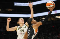 Phoenix Mercury guard Shey Peddy drives past Chicago Sky guard Allie Quigley (14) during the first half of Game 2 of basketball's WNBA Finals, Wednesday, Oct. 13, 2021, in Phoenix. (AP Photo/Rick Scuteri)