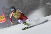 FILE - Austria's Ricarda Haaser speeds down the course during an alpine ski, women's World Cup giant slalom, in Kronplatz, Italy, Wednesday, Jan. 25, 2023. Once known as skiing’s “Wunderteam” for its domination of the ski racing circuit, Austrian men and women have both been struggling for results this season while Austrian coaches are lending their expertise to other nations. (AP Photo/Alessandro Trovati, File)