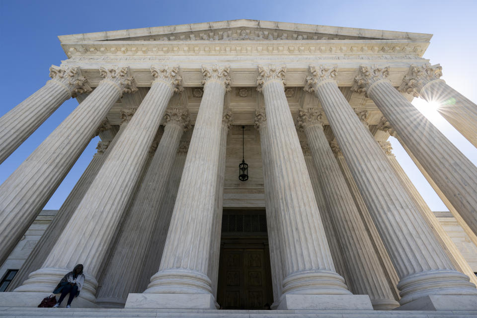 The Supreme Court is seen in Washington, Wednesday morning, Oct. 7, 2020. The Supreme Court is agreeing to review a Trump administration policy that makes asylum-seekers wait in Mexico for U.S. court hearings. As is typical, the court did not comment Monday in announcing it would hear the case. Because the court’s calendar is already full through the end of the year, the justices will not hear the case until 2021. (AP Photo/J. Scott Applewhite)