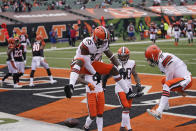 Cleveland Browns' David Njoku (85) and quarterback Baker Mayfield (6) celebrate a touchdown reception by Njoku during the second half of an NFL football game against the Cincinnati Bengals, Sunday, Oct. 25, 2020, in Cincinnati. (AP Photo/Bryan Woolston)