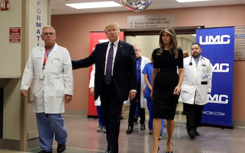 President Donald Trump and first lady Melania Trump - Credit: AP