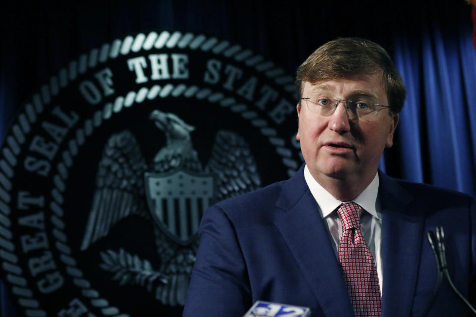 Republican Gov. Tate Reeves speaks with reporters on a variety of issues, including the state prison system and the state auditor's office investigation of the former director of Mississippi's welfare agency and four other people, accused of embezzling millions in federal money meant for the poor, Thursday, Feb. 6, 2020, in Jackson, Miss. (AP Photo/Rogelio V. Solis)