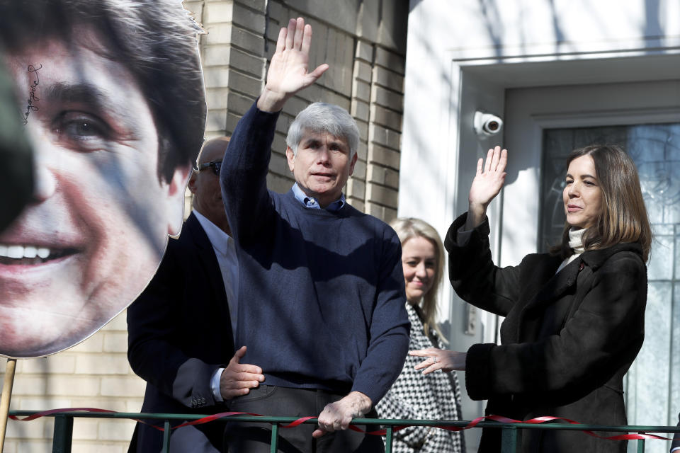 Former Illinois Gov. Rod Blagojevich and his wife Patti wave to supporters after a news conference outside his home Wednesday, Feb. 19, 2020, in Chicago. On Tuesday, President Donald Trump commuted his 14-year prison sentence for political corruption. (AP Photo/Charles Rex Arbogast)