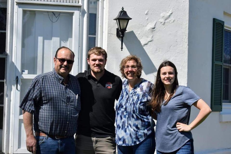 The Frankart family, left to right are Bill, Brady, Janet and Kayla Frankart. They are standing in front of the octagon home Bill and Janet purchased last year.