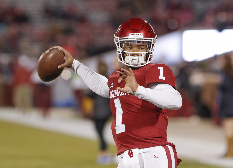 FILE - In this Saturday, Nov. 17, 2018 file photo, Oklahoma quarterback Kyler Murray (1) before the start of an NCAA college football game against Kansas in Norman, Okla. Kyler Murray suddenly has a bunch of new fans in the Oakland Athletics organization, even if they cringe watching Heisman Trophy winner play quarterback for Oklahoma. The A's don't want their prized first-round draft pick hurt on the football field because they are counting on him wearing an Oakland jersey come spring training. (AP Photo/Alonzo Adams, File)