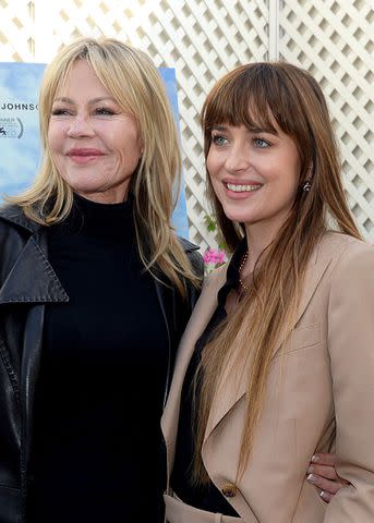 <p>Vivien Killilea/Getty Images for Netflix</p> Melanie Griffith, Dakota Johnson