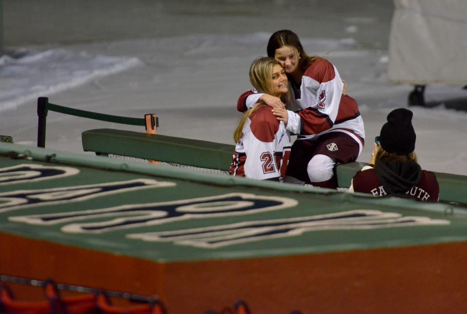 BOSTON -- 01/12/23 -- Falmouth's Hailey Ferreira, left, and Casey Roth pose for photos in the dugout before Thursday's scrimmage.