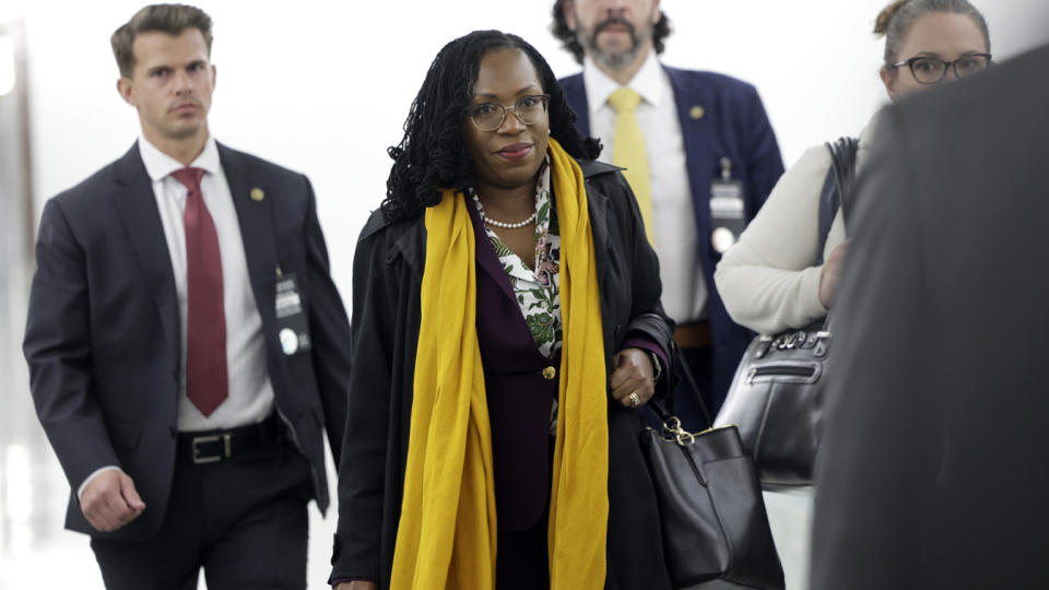 Supreme Court nominee Ketanji Brown Jackson walks to a meeting on Capitol Hill.