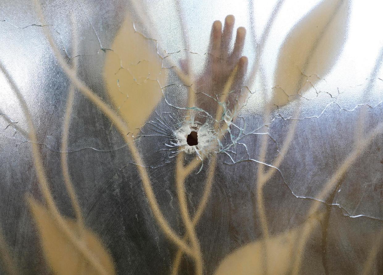 <span>A glass door pierced by a bullet at the Fontaine hospital centre in Port-au-Prince, November 2023. Only one public hospital remains open in the capital. </span><span>Photograph: Odelyn Joseph/AP</span>