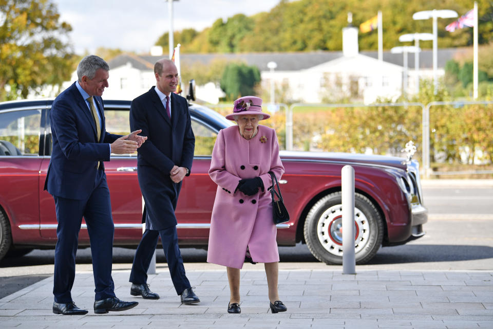 SALISBURY, ENGLAND - OCTOBER 15: Britain's Queen Elizabeth II (R) and Prince William, Duke of Cambridge, (C) speak with Dstl Chief Executive Gary Aitkenhead (L) as they head back to the Energetics Analysis Centre during their visit to the Defence Science and Technology Laboratory (Dstl) at Porton Down science park on October 15, 2020 near Salisbury, England. The Queen and the Duke of Cambridge visited the Defence Science and Technology Laboratory (Dstl) where they were to view displays of weaponry and tactics used in counter intelligence, a demonstration of a Forensic Explosives Investigation and meet staff who were involved in the Salisbury Novichok incident. Her Majesty and His Royal Highness also formally opened the new Energetics Analysis Centre. (Photo by Ben Stansall - WPA Pool/Getty Images)