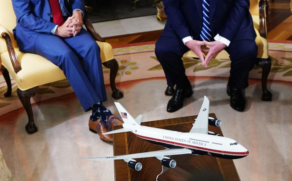 FILE: A model of Air Force One with a new color scheme is seen during a bilateral meeting between US President Trump (R) and Canada's Prime Minister  Trudeau in the Oval Office of the White House in Washington, DC on  June 20, 2019. / Credit: MANDEL NGAN/AFP via Getty Images
