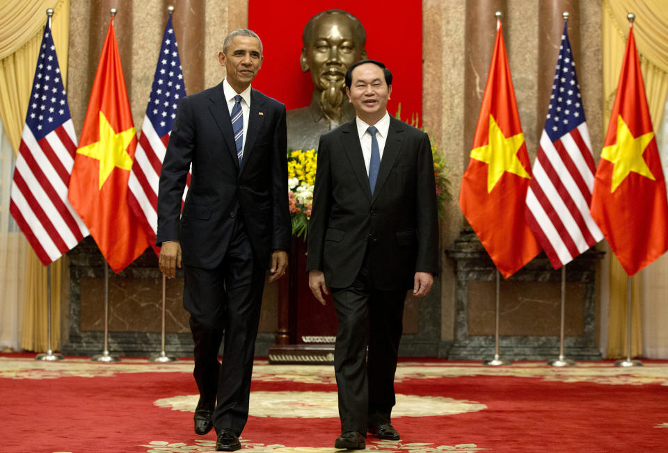 <p>U.S. President Barack Obama, left, and Vietnamese President Tran Dai Quang walk to a meeting after shaking hands at the Presidential Palace in Hanoi, Vietnam, Monday, May 23, 2016. The president is on a weeklong trip to Asia as part of his effort to pay more attention to the region and boost economic and security cooperation. (AP Photo/Carolyn Kaster) </p>