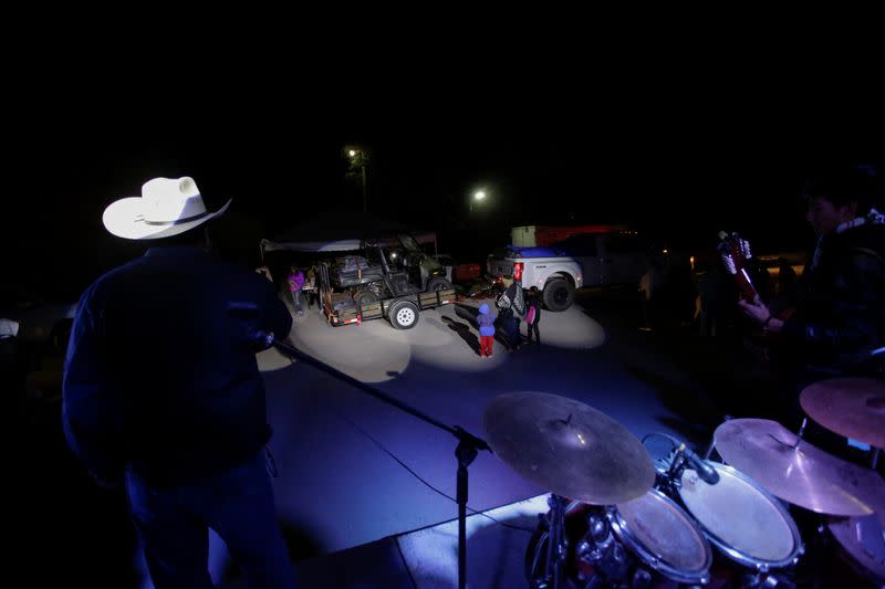 A migrant family part of the 12th Caravan of Migrants, are received with music during their journey towards Jalpan de Serra, in San Ciro de Acosta