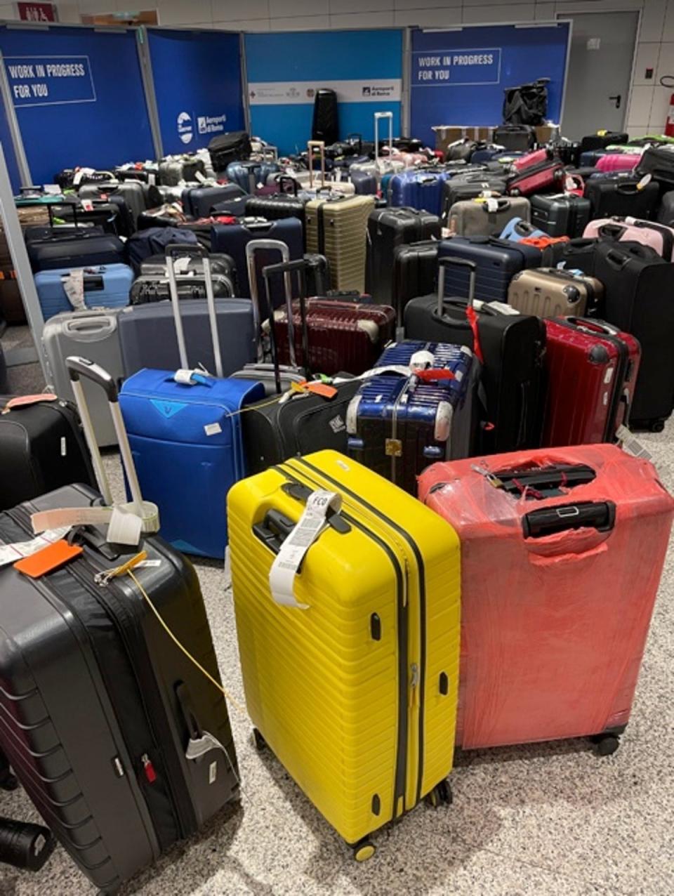 Lisa Khan’s luggage among a pile of lost bags at Florence Airport (Courtesy of Lisa Khan)