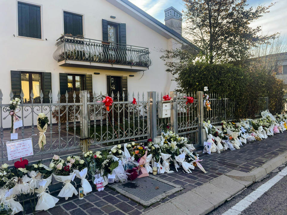 Flowers are left outside the house where 22-year-old Giulia Cecchettin used to live with her family in Vigonovo, near Venice, northern Italy, Sunday, Nov. 19, 2023. Her body, reportedly with multiple stab wounds, was found wrapped in plastic on Saturday in a ditch near Venice. Police in Germany over the weekend arrested Filippo Turetta, 21, who had been on the run since Nov. 11, when he was last seen arguing with Giulia Cecchettin. (Contaldo/LaPresse via AP)