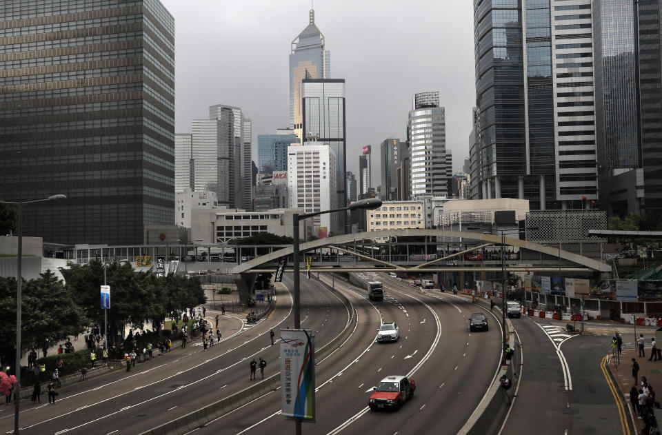 A downtown main road open as protesters leave the area near the Legislative Council following a massive protest against an extradition bill in Hong Kong, Monday, June 17, 2019. Protesters in Hong Kong have begun leaving the streets and gathering near the city's government headquarters. (AP Photo/Vincent Yu)