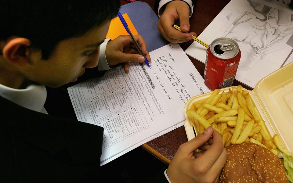 In areas such as Camberwell Green children have dozens of fast food options on their way home - Getty Images