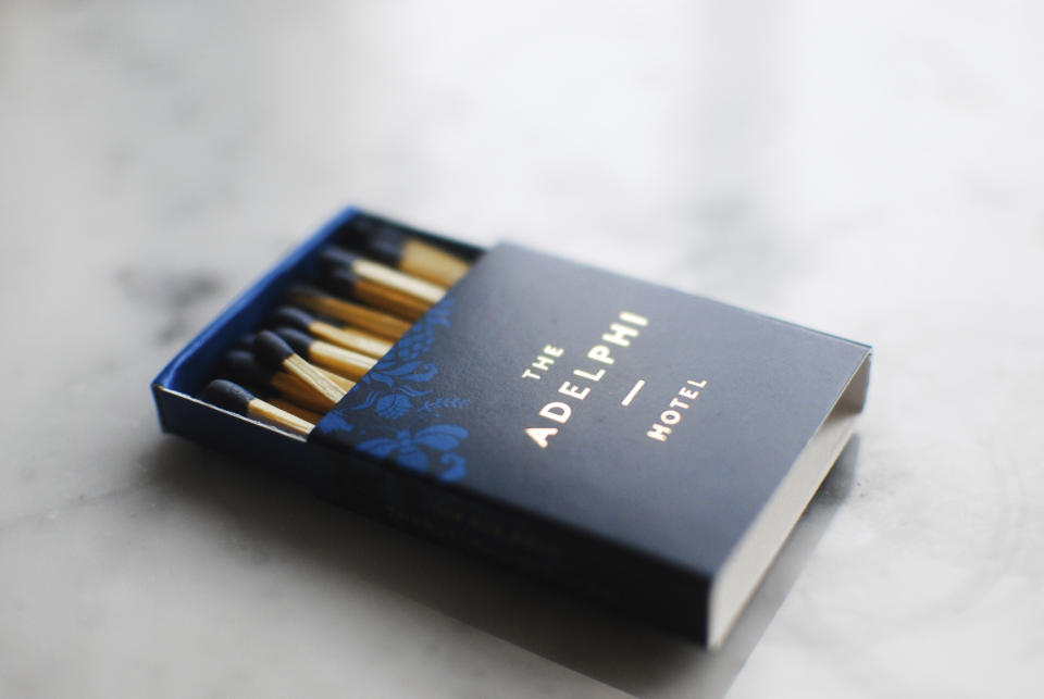This image released by Might & Main shows a book of matches designed for The Adelphi Hotel in Saratoga Springs, N.Y. (Might & Main via AP)