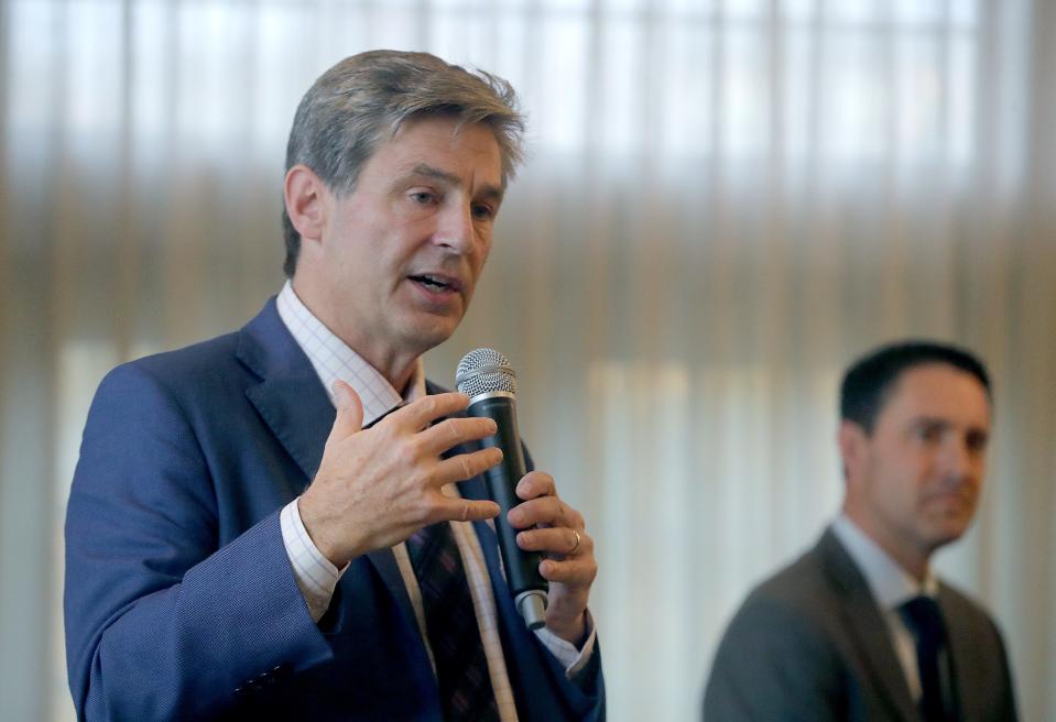 State Senator Matt Dolan answers a question as Secretary of State Frank LaRose listens during a GOP debate of U.S. Senator hopefuls on Thursday in Akron.