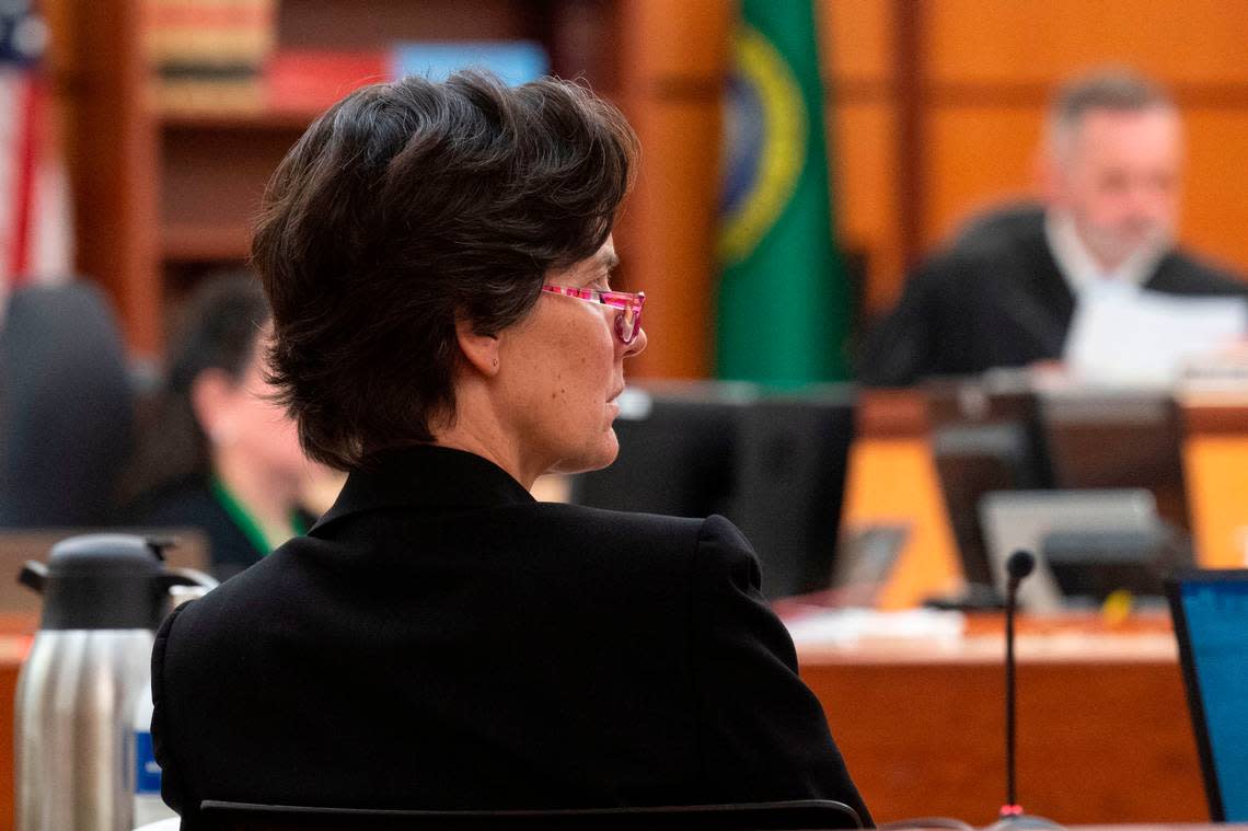 Washington state assistant attorney general Melanie Tratnik listens as Anne Bremner, the defense attorney for Pierce County Ed Troyer, addresses the court on Monday, Dec. 12, 2022, in Pierce County District Court in Tacoma.