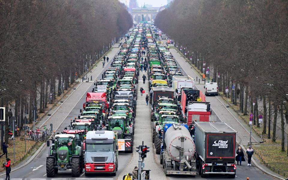 Agricultural workers bring traffic to a standstill at Berlin's Brandenburg Gate on Monday