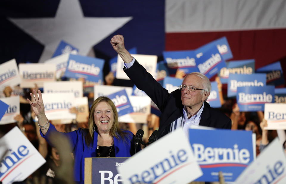 Sen. Bernie Sanders, I-Vt., right, with his wife Jane, raises his hand as he speaks during a campaign event in San Antonio on Feb. 22, 2020. (Eric Gay/AP)