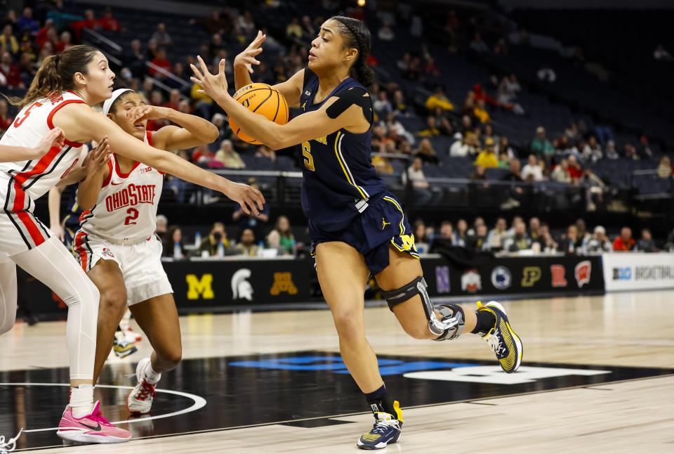 Laila Phelia of the Michigan Wolverines rebounds the ball against the Ohio State Buckeyes in the second half of the game in the quarterfinals of the Big Ten women's basketball tournament at Target Center in Minneapolis on Friday, March 3, 2023.