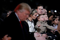 <p>White House senior advisor Jared Kushner, seated with his wife White House senior advisor Ivanka Trump and their children, looks over at U.S. President Donald Trump as he bows his head during the prayer at the National Christmas Tree lighting ceremony near the White House in Washington, Nov. 30, 2017. (Photo: Jonathan Ernst/Reuters) </p>