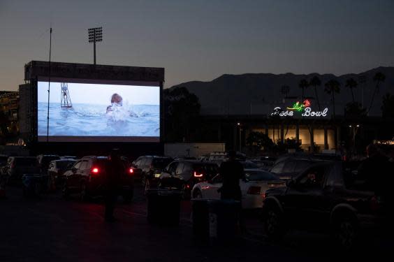 People watch Jaws as part of the Tribeca Film Festival's drive-in movie series at the Rose Bowl in Pasadena, California, on July 2, 2020 (ROBYN BECK/AFP via Getty Images)