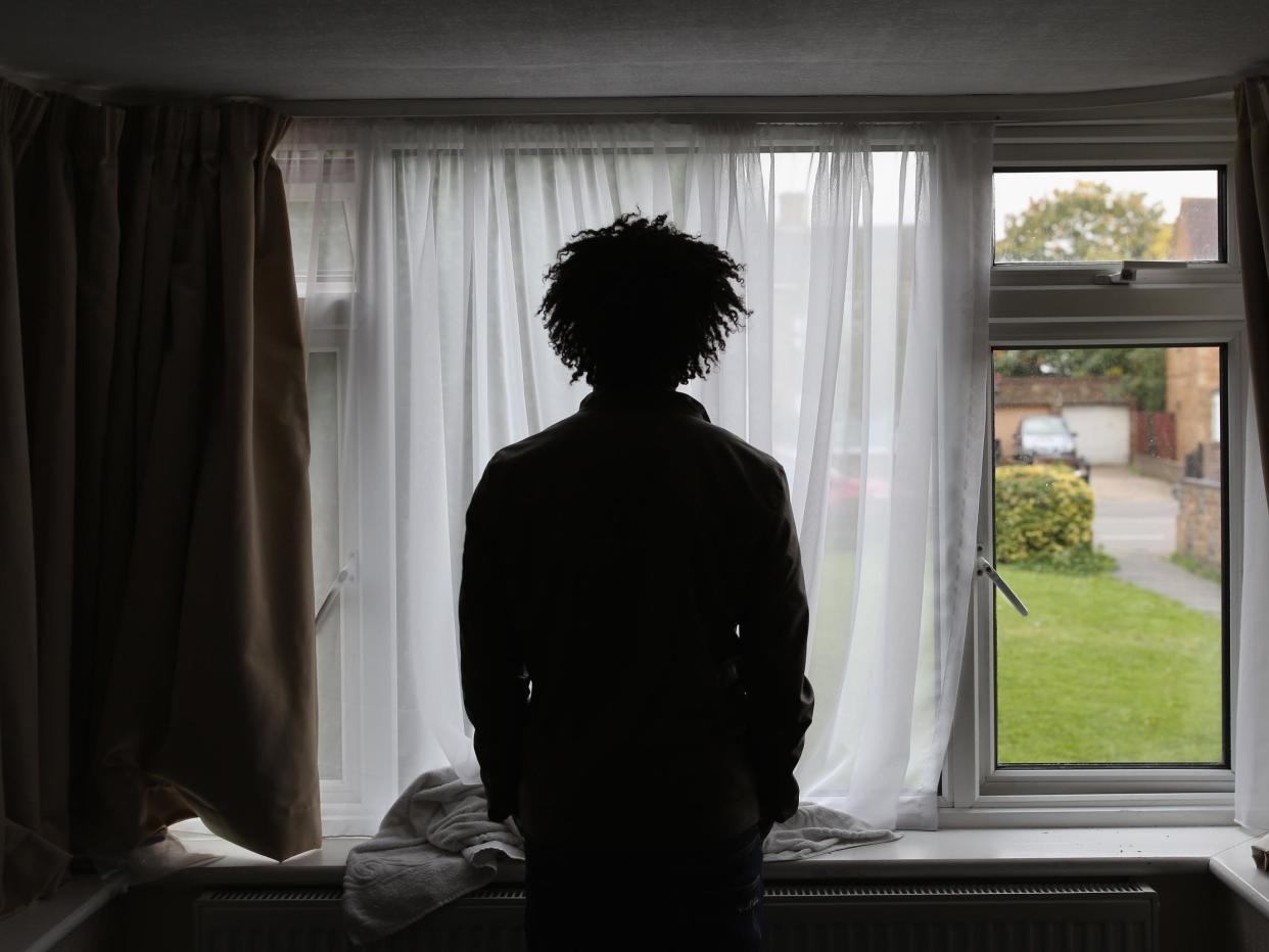 Asylum seeker, Merhawi, from Eritrea, stands inside his single room accommodation in Longford, England 2015: Getty Images