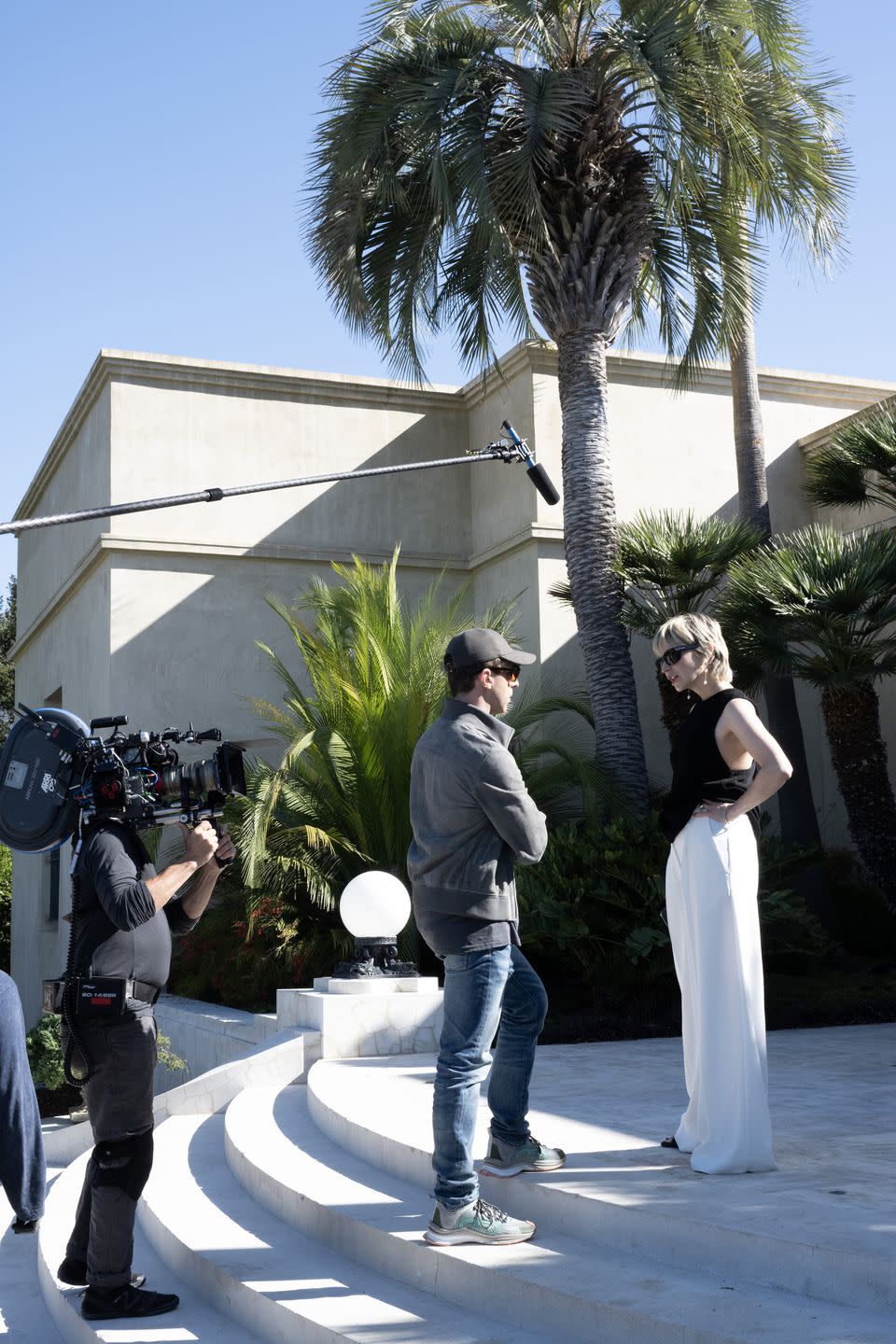 a moment from filming an episode of succession in which actor jeremy strong, who plays kendall roy, talks to annabelle dexter jones, who plays naomi pierce, on the steps of the pierce family estate