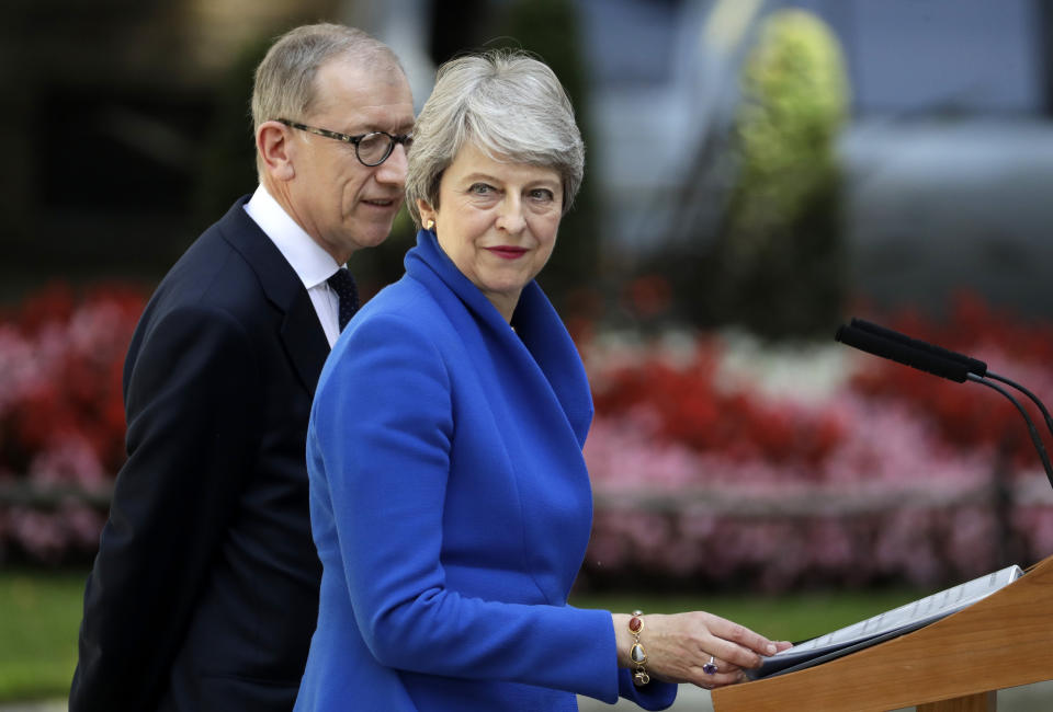 Britain's Prime Minister Theresa May prepares to speak before leaving 10 Downing Street, London for Buckingham Palace, Wednesday, July 24, 2019. Boris Johnson will replace May as Prime Minister later Wednesday, following her resignation last month after Parliament repeatedly rejected the Brexit withdrawal agreement she struck with the European Union. (AP Photo/Matt Dunham)