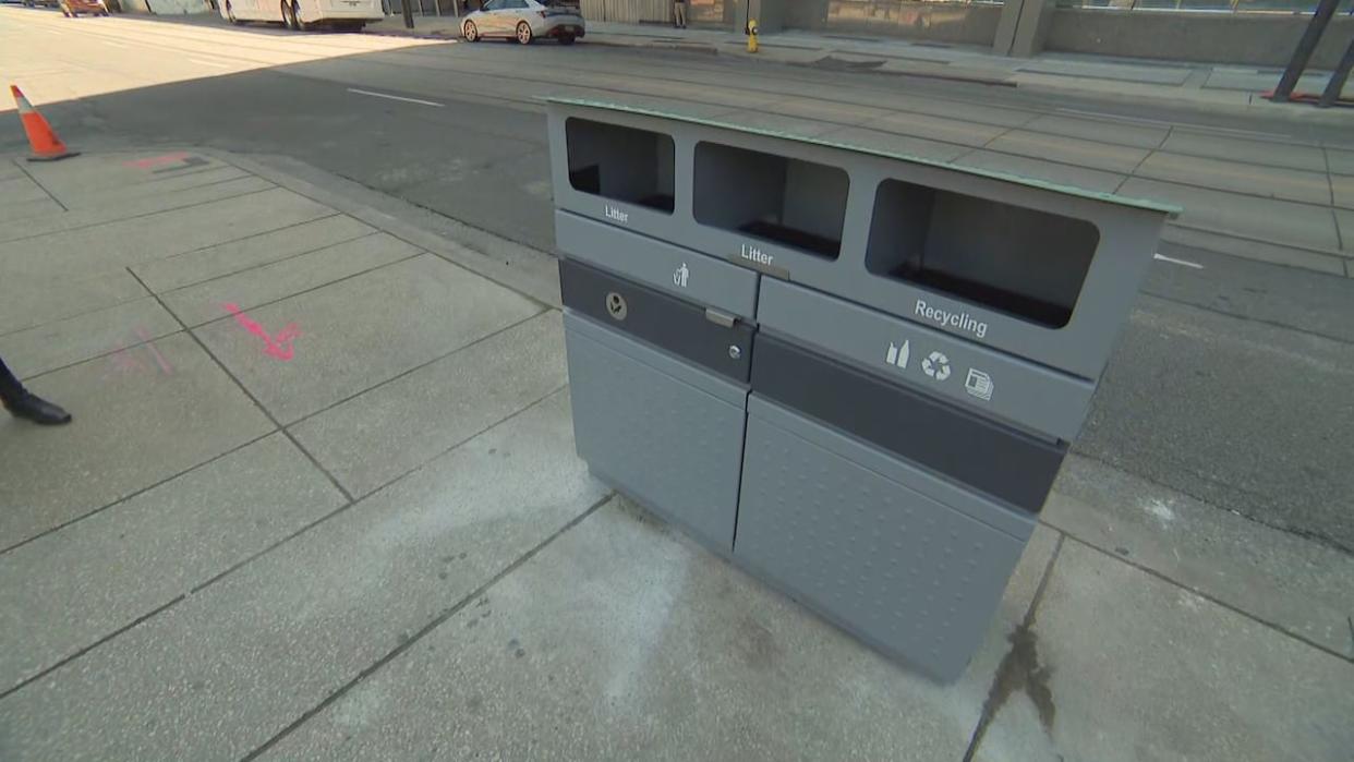 The City of Toronto said its newly designed trash bins feature a wider opening to reduce the likelihood of disposed items getting stuck. More than 1,000 bins are expected to be added in high-density areas by the end of the year. (Spencer Gallichan-Lowe/CBC - image credit)