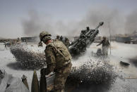 <p>U.S. Army soldiers from the 2nd Platoon, B battery 2-8 field artillery, fire a howitzer artillery piece at Seprwan Ghar forward fire base in Panjwai district, Kandahar province southern Afghanistan, June 12, 2011. (Photo: Baz Ratner/Reuters) </p>
