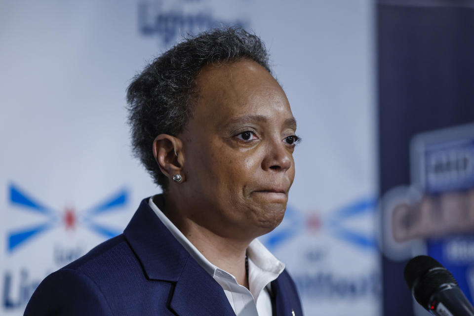 Chicago Mayor Lori Lightfoot stands at a podium.