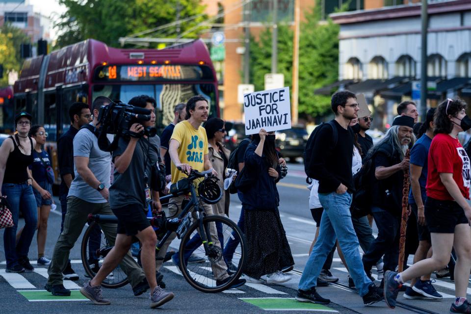 People march through downtown Seattle on Sept. 14, 2023, after learning about comments a police officer made about the death of Jaahnavi Kandula, 23, whom an officer fatally struck with his police cruiser.