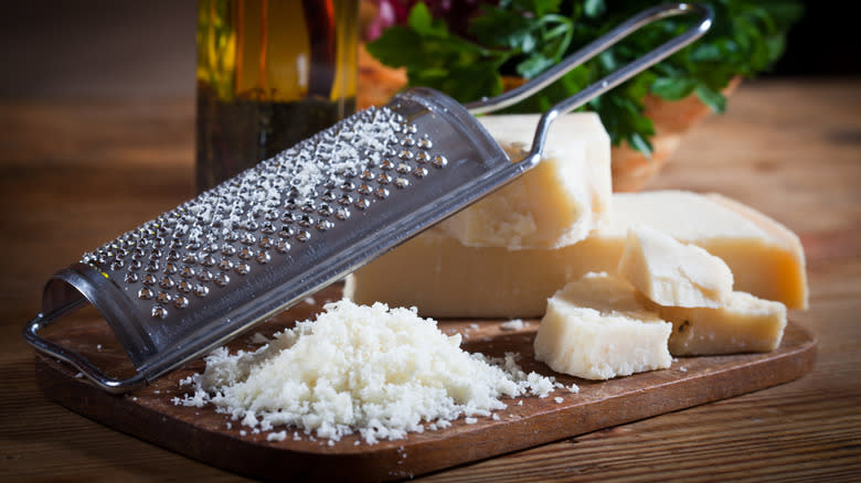 grated parmesan on wooden board