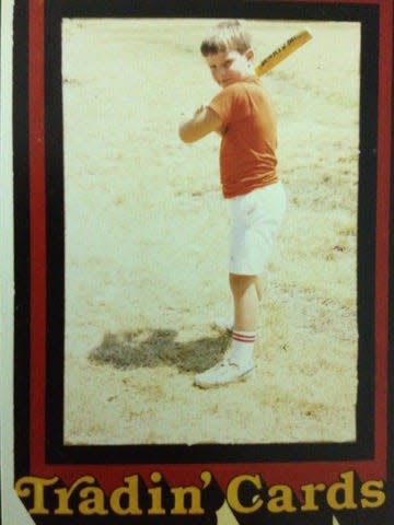 A commemorative trading card shows a young Damon Parker during his little league days.