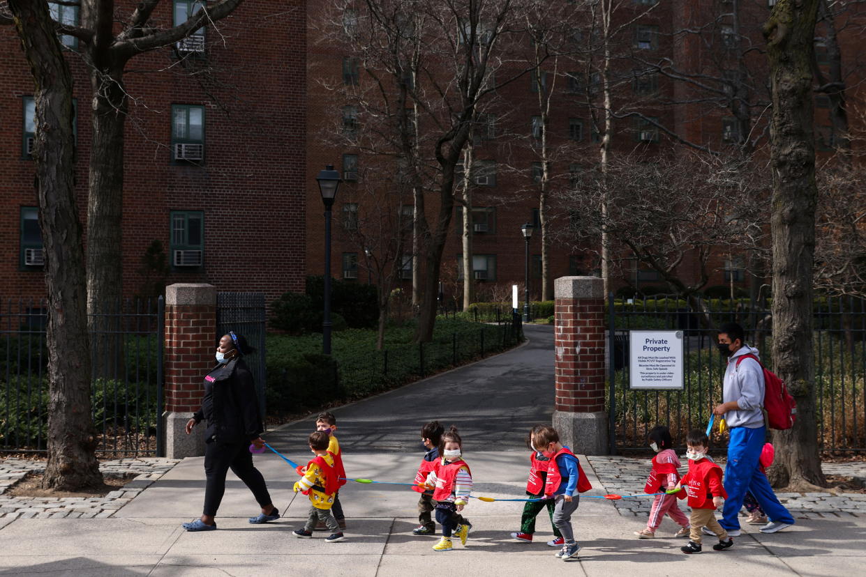 Children are seen walking, on the first day of lifting the indoor mask mandate for DOE schools between K through 12, in Manhattan, New York City, New York, U.S., March 7, 2022. REUTERS/Andrew Kelly