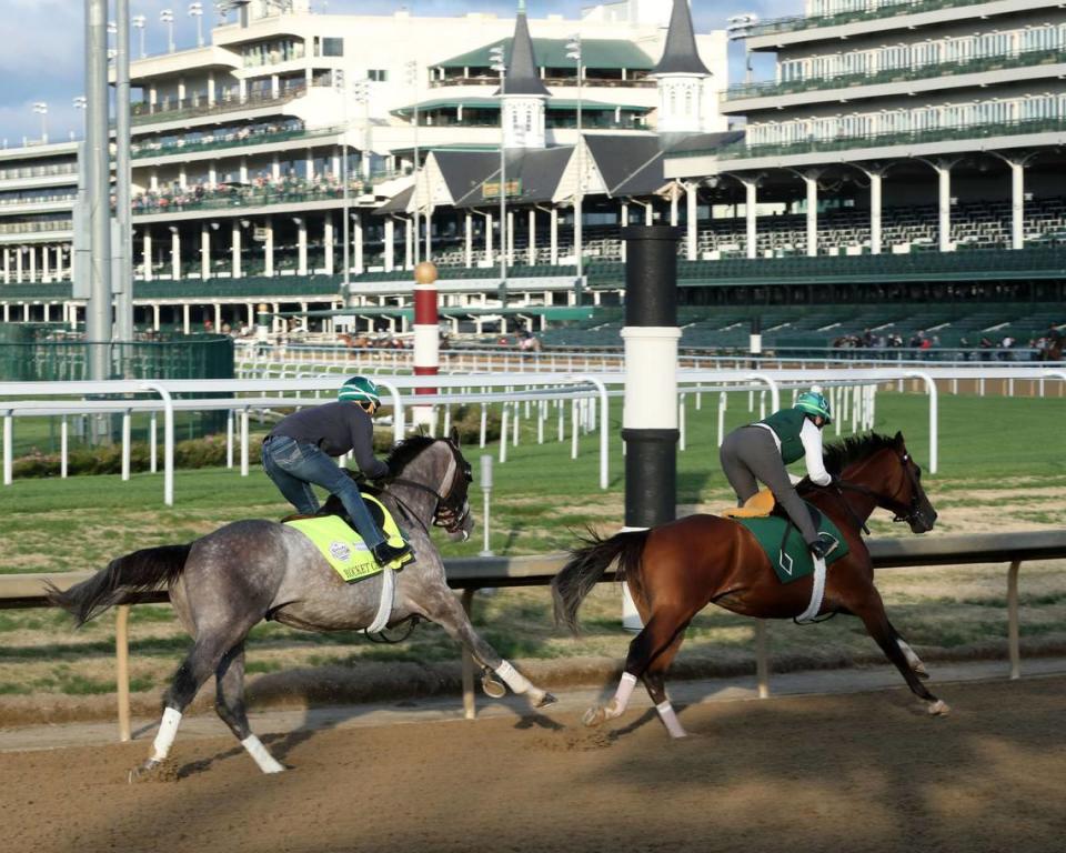 Kentucky Derby hopeful Rocket Can, left, works out at Churchill Downs on Sunday.