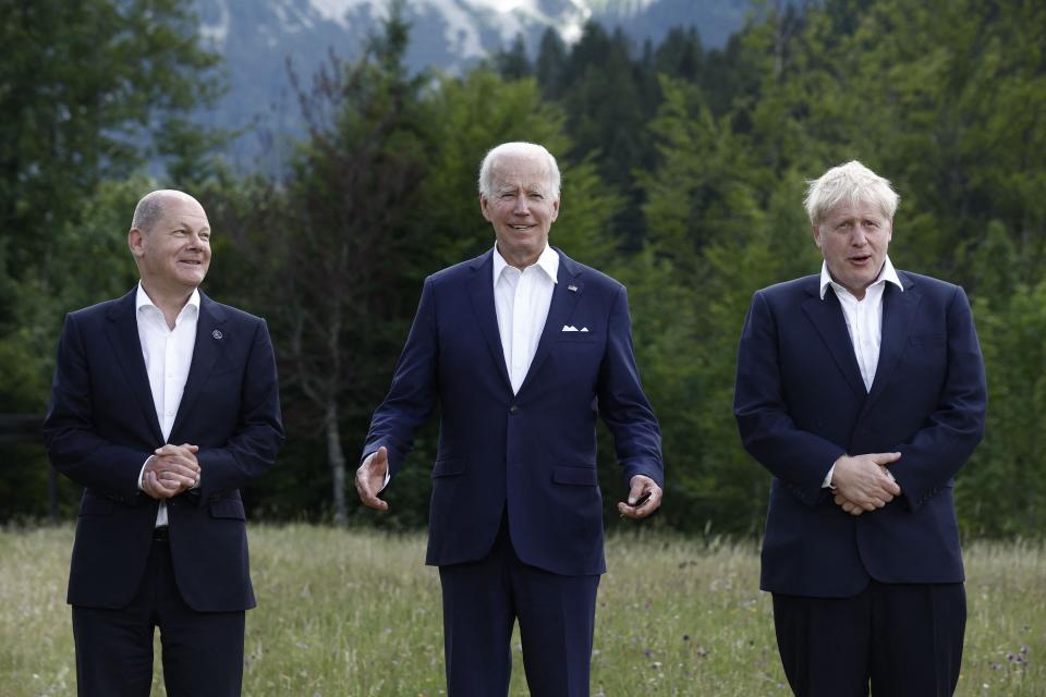 Germany's Chancellor Olaf Scholz (L), US President Joe Biden (C) and Britain's Prime Minister Boris Johnson (R) pose for a family photo during the G7 Summit, which is being held this year at Schloss Elmau near the Bavarian Alps.