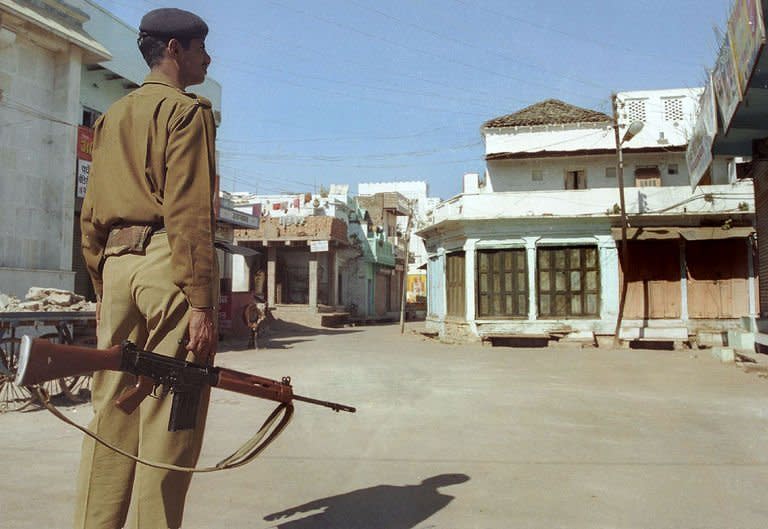 A Indian policeman patrols Ganjbasoda in Madhya Pradesh state on January 15, 2003. A Swiss female tourist was gang-raped in Madhya Pradesh -- the latest victim of sexual violence against women in the South Asian nation