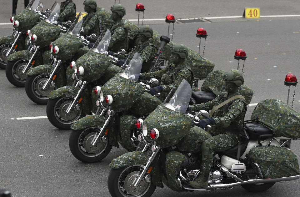 Members of the Taiwan Special Forces perform during the National Day celebrations in Taipei, Taiwan, Saturday, Oct. 10, 2020. (AP Photo/Chiang Ying-ying)