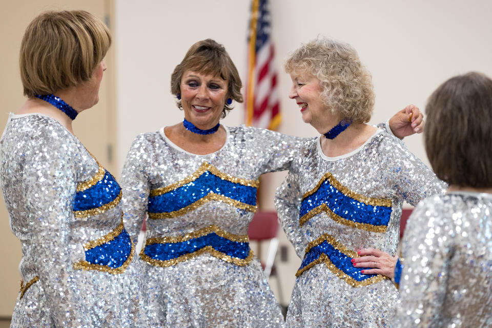 *** EXCLUSIVE - VIDEO AVAILABLE ***  SUN CITY, ARIZONA - OCTOBER 02: Greta, Gloria and Ruth pause for breath during a practice in Sun City, Arizona, 2 October 2017.  A GROUP of acrobatic pensioners are refusing to let age or arthritis cramp their high kicks in a cheerleading squad for the over 50s. The Arizona-based troupe is a marching and performance group for women over 55 - with an average age of just over 70. While plenty of women use retirement as an opportunity to rest on their laurels, these dancers are glittering and shaking into their twilight years.   PHOTOGRAPH BY Dave Cruz / Barcroft Images (Photo credit should read Dave Cruz / Barcroft Media via Getty Images / Barcroft Media via Getty Images)