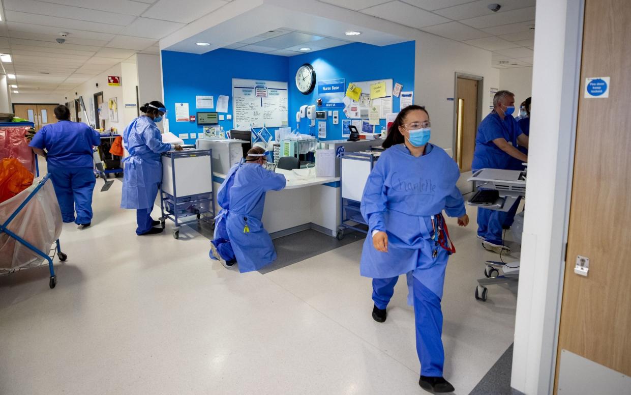 Hospital staff on a Covid-19 ward - PA