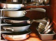 <p>Is your jam-packed kitchen cabinet just one pot or pan away from a cookware avalanche? Arrange bargain <a href="http://www.bobvila.com/slideshow/10-ways-to-make-office-supplies-work-overtime-49267" rel="nofollow noopener" target="_blank" data-ylk="slk:paper sorters;elm:context_link;itc:0;sec:content-canvas" class="link ">paper sorters</a> on your shelves to instantly curb cabinet chaos. Situated horizontally or vertically, these racks can wrangle cookware, cutting boards, and even recipe books! <i>Photo: <a href="http://www.kevinandamanda.com/whatsnew/house-and-home/kitchen-cabinet-organization.html" rel="nofollow noopener" target="_blank" data-ylk="slk:kevinandamanda.com;elm:context_link;itc:0;sec:content-canvas" class="link ">kevinandamanda.com</a><br></i><b>RELATED: <a href="http://www.bobvila.com/slideshow/12-bite-size-projects-to-rescue-your-tiny-kitchen-48981" rel="nofollow noopener" target="_blank" data-ylk="slk:12 Bite-Size Projects to Rescue Your Tiny Kitchen;elm:context_link;itc:0;sec:content-canvas" class="link ">12 Bite-Size Projects to Rescue Your Tiny Kitchen</a></b></p>